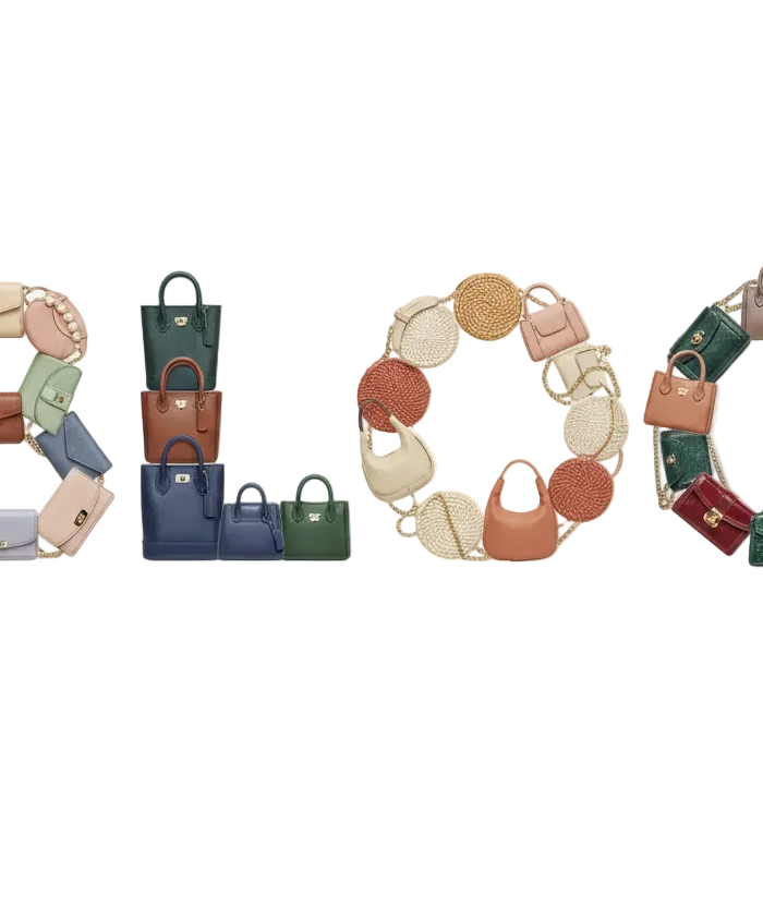 Colorful handbags arranged to spell out 'BLOG’on a white background