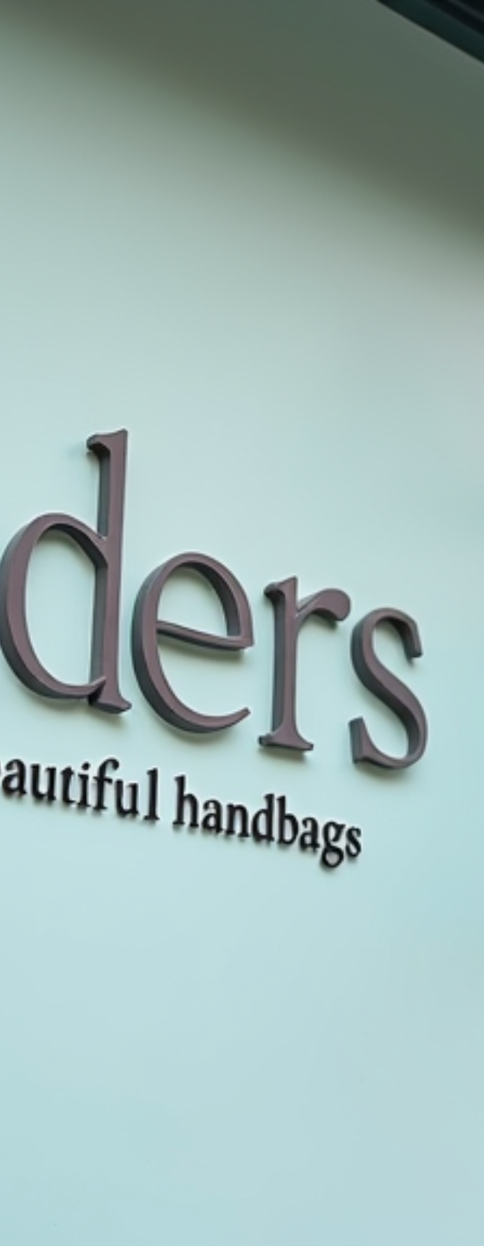 Storefront with 'Conders' sign and 'Open' sign