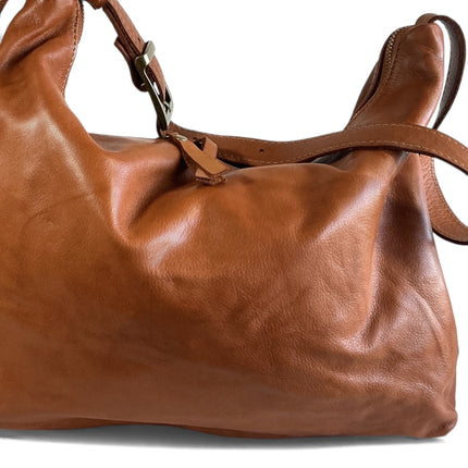 Brown full grain leather handbag on a white background
