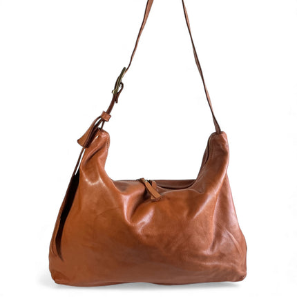 Brown full grain leather handbag on a white background