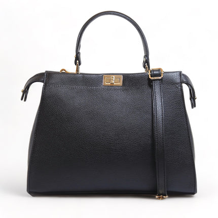 Black leather grab handle handbag with gold tone fittings on a white background