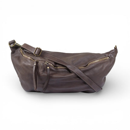 Brown leather sling bag with a strap on a white background