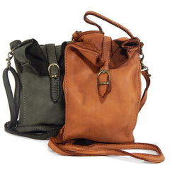 Two leather bags, one green and one brown, on a white background